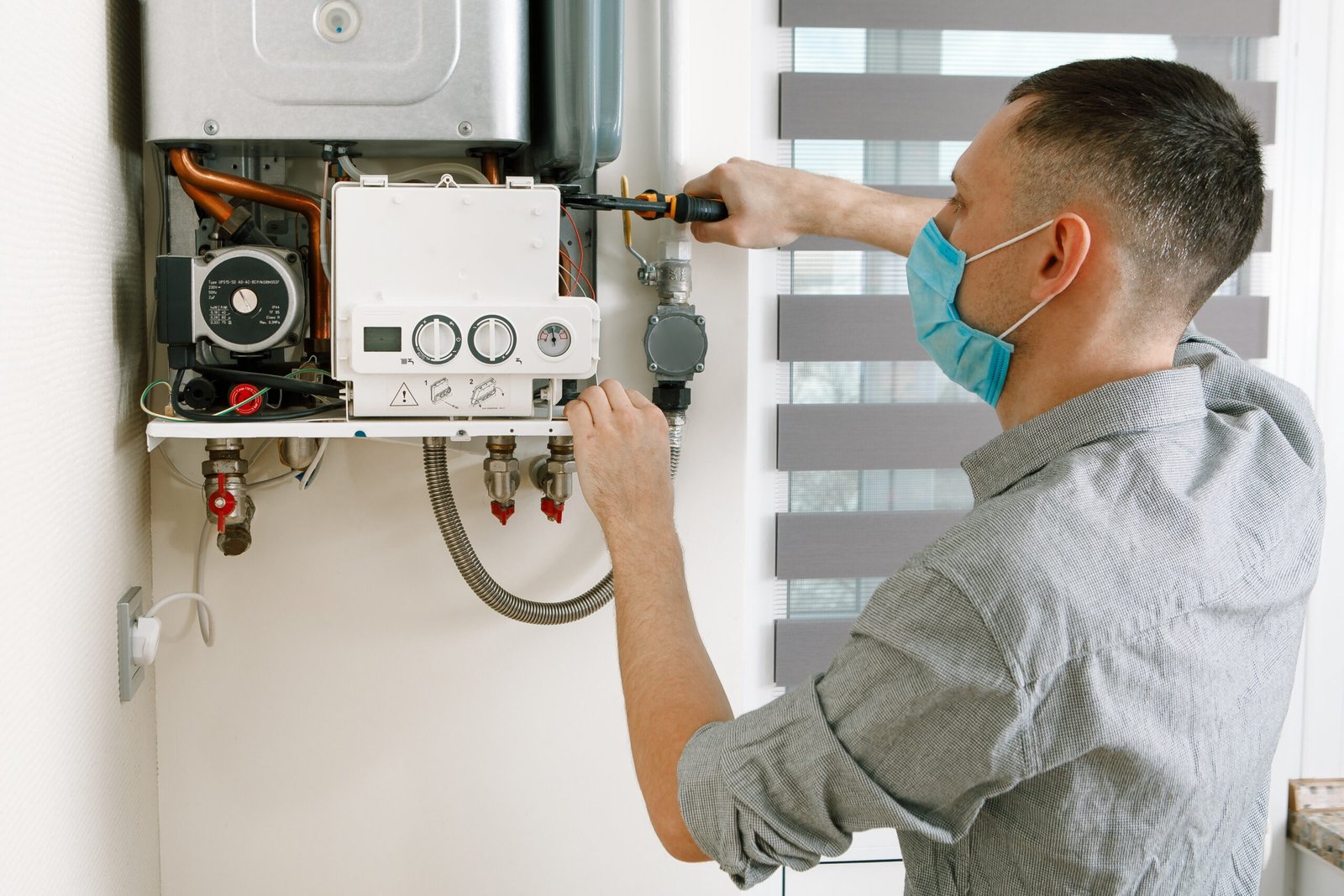 plumber-attaches-trying-fix-problem-with-residential-heating-equipment-repair-gas-boiler
